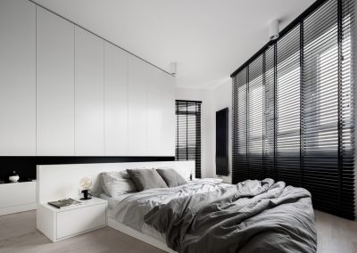 White bedroom with big windows