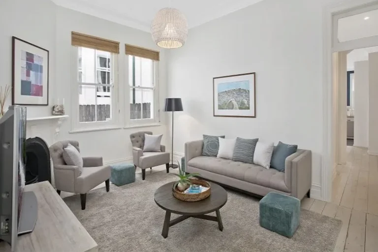 Dated lounge room with old finishes before renovation in Burleigh Heads