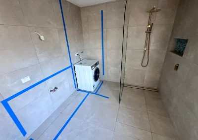 Bathroom with new tiles and waterproofing tape during bathroom renovation at Main Beach